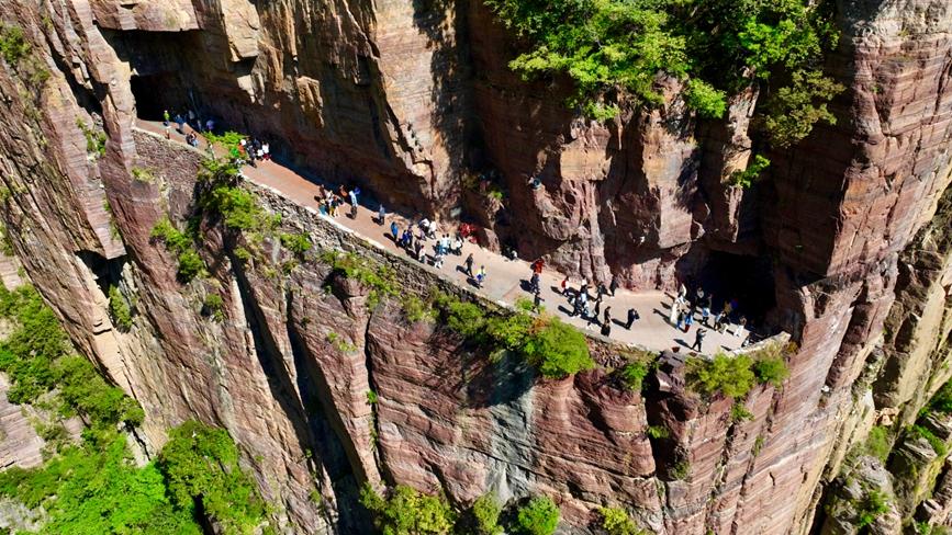 Cliffside marvel: Guoliang tunnel draws summer crowds to C China's Henan